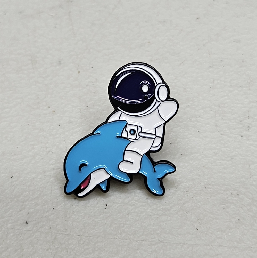 Astronaut 'Dolphin Ride' Enamel Pin